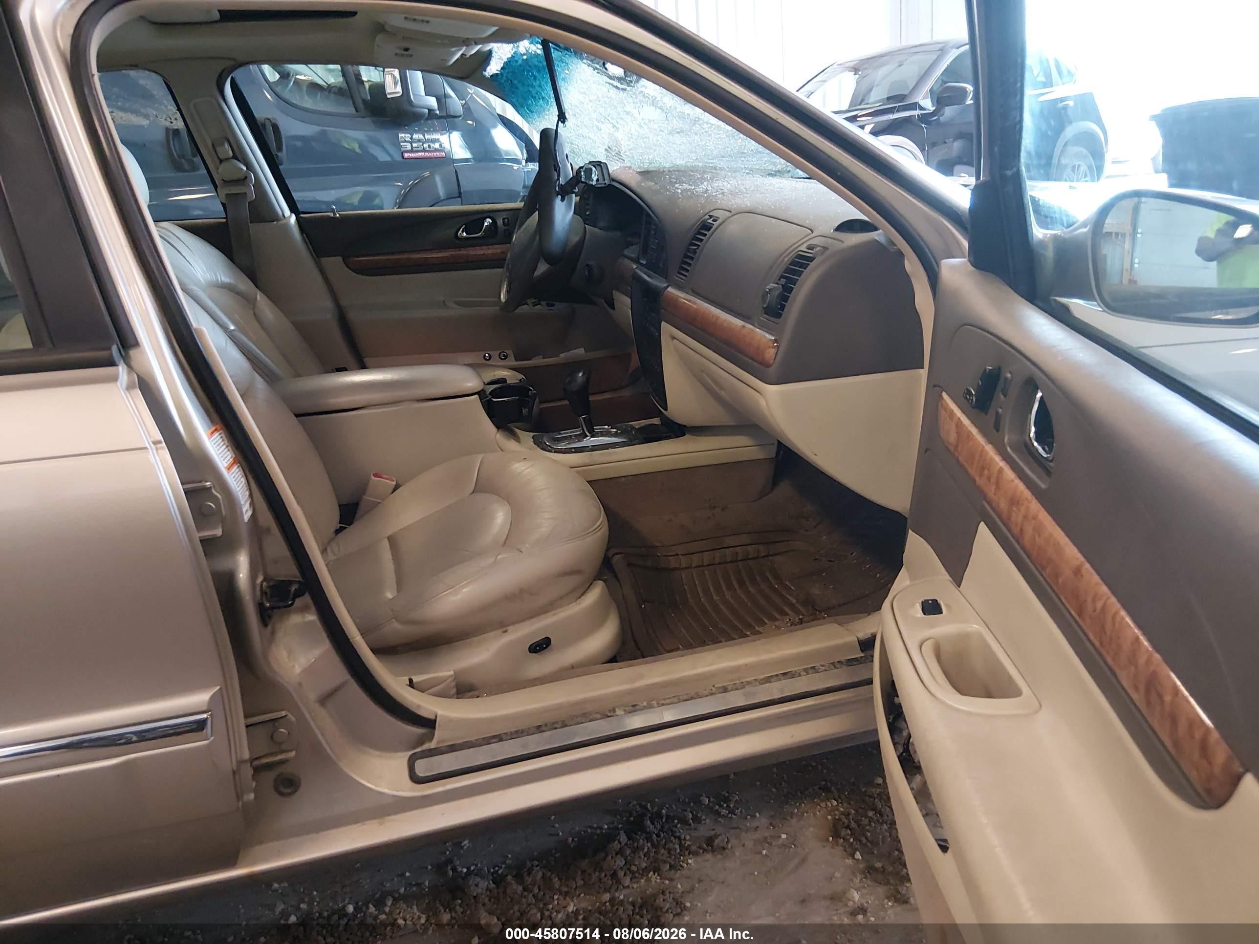 2002 Lincoln Continental   Tan vin: 1LNHM97V32Y695992