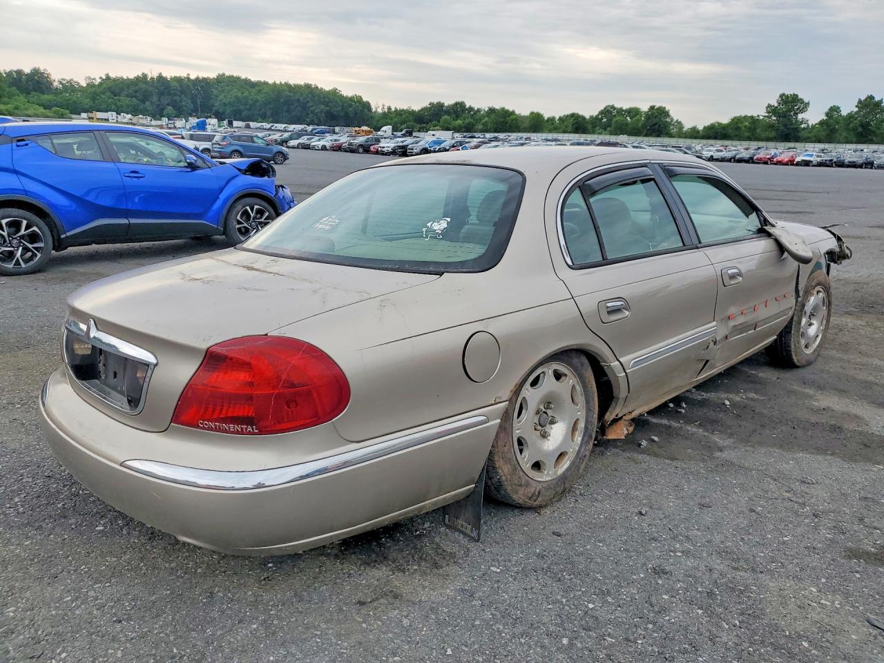 1999 Lincoln Continental Tan vin: 1LNHM97V3XY715827