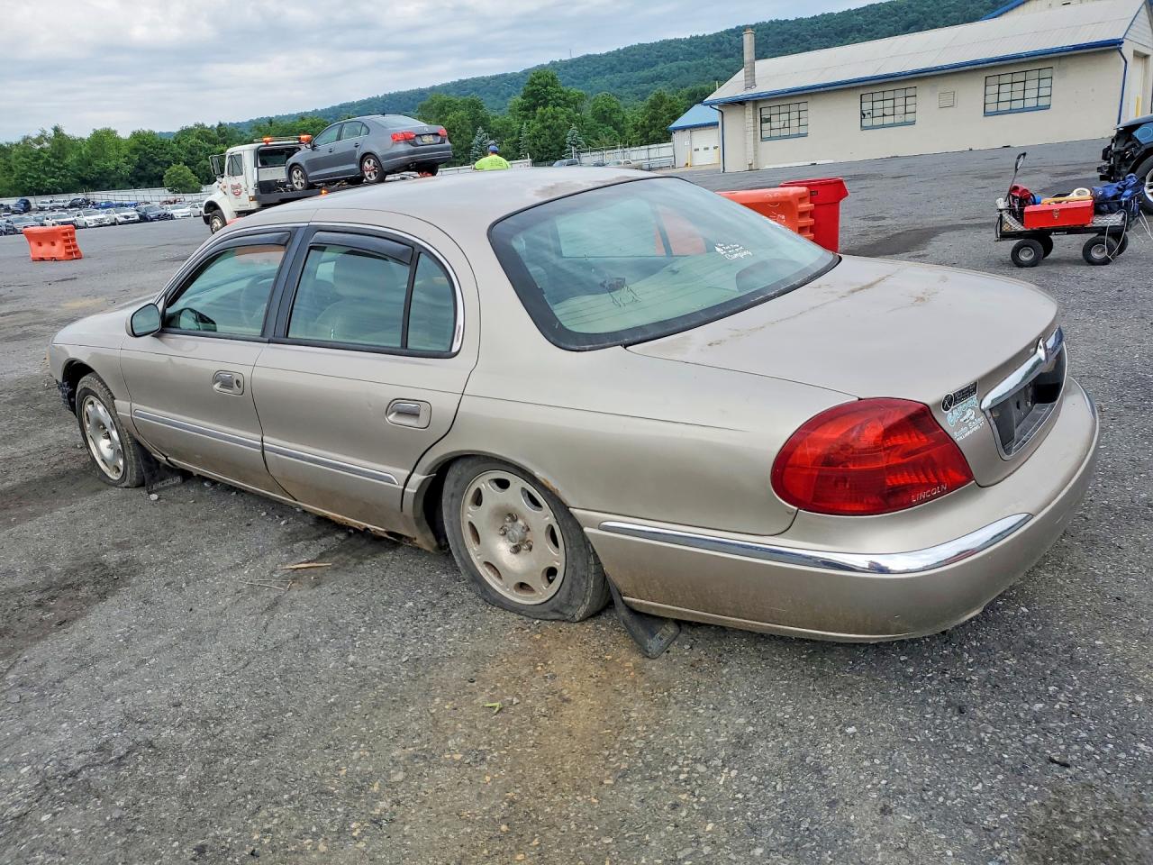 1999 Lincoln Continental Tan vin: 1LNHM97V3XY715827