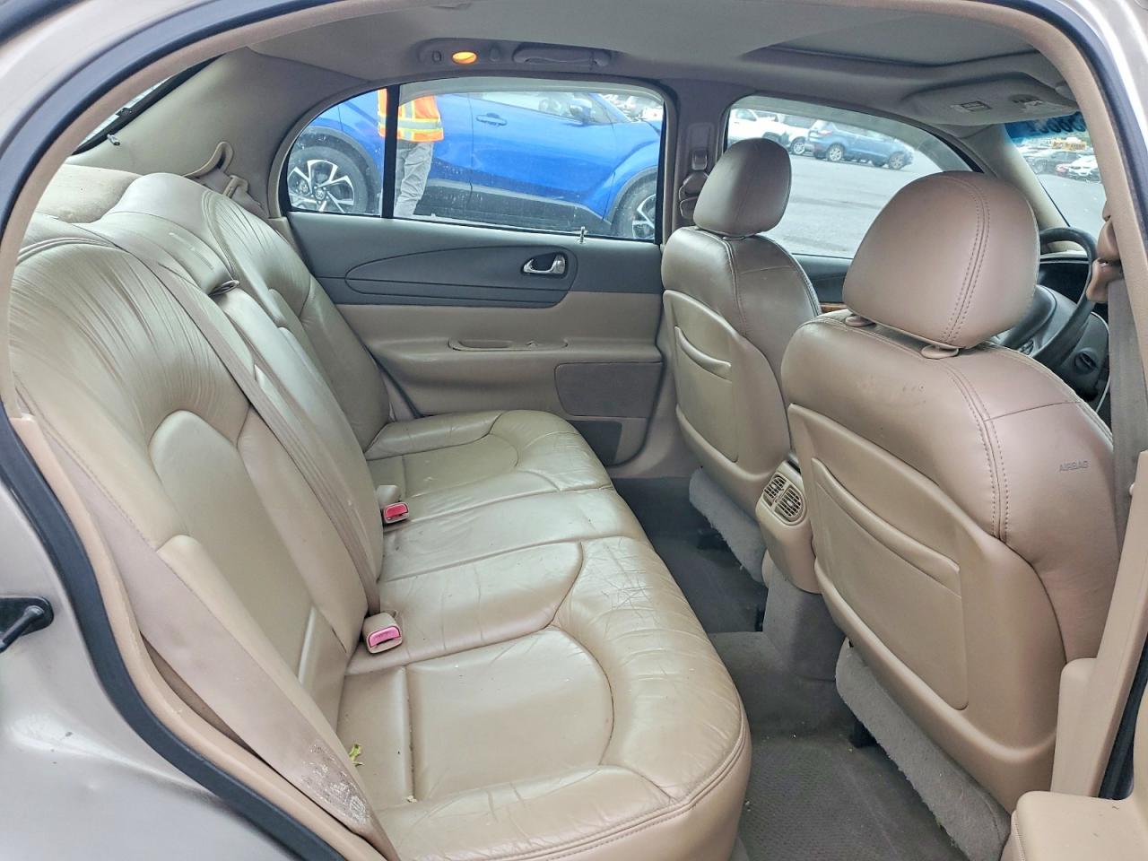 1999 Lincoln Continental Tan vin: 1LNHM97V3XY715827