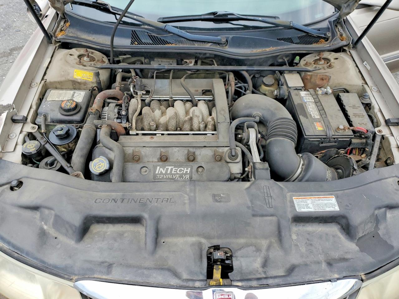 1999 Lincoln Continental Tan vin: 1LNHM97V3XY715827