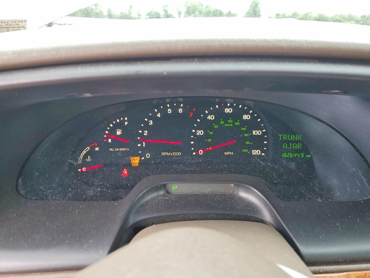 1999 Lincoln Continental Tan vin: 1LNHM97V3XY715827