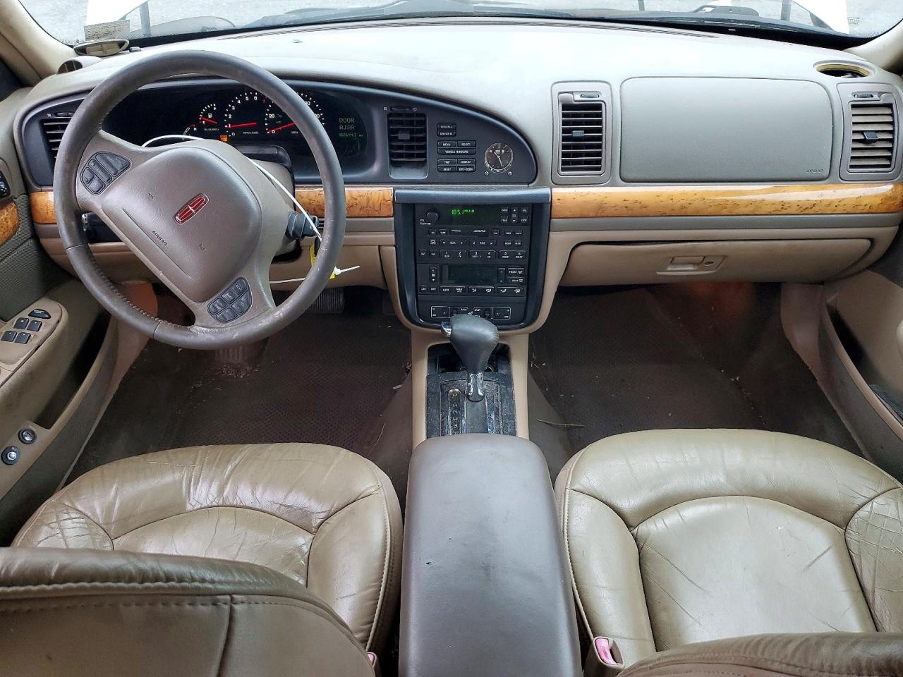 1999 Lincoln Continental Tan vin: 1LNHM97V3XY715827