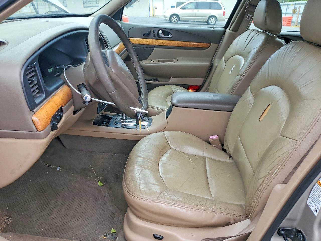 1999 Lincoln Continental Tan vin: 1LNHM97V3XY715827