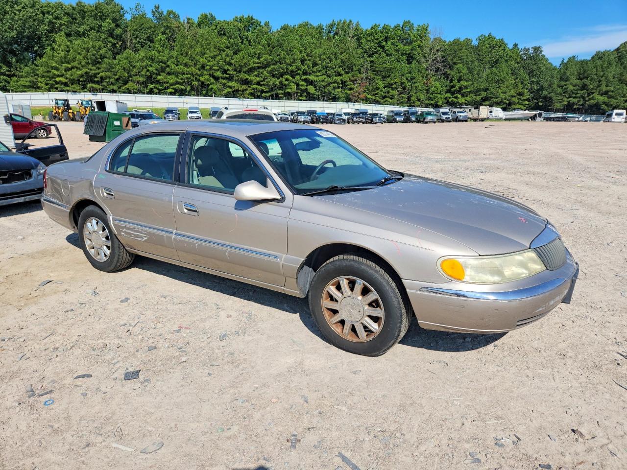 2002 Lincoln Continental Tan vin: 1LNHM97V52Y700089