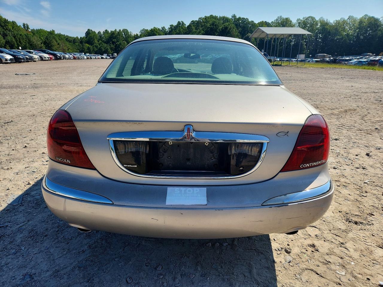 2002 Lincoln Continental Tan vin: 1LNHM97V52Y700089