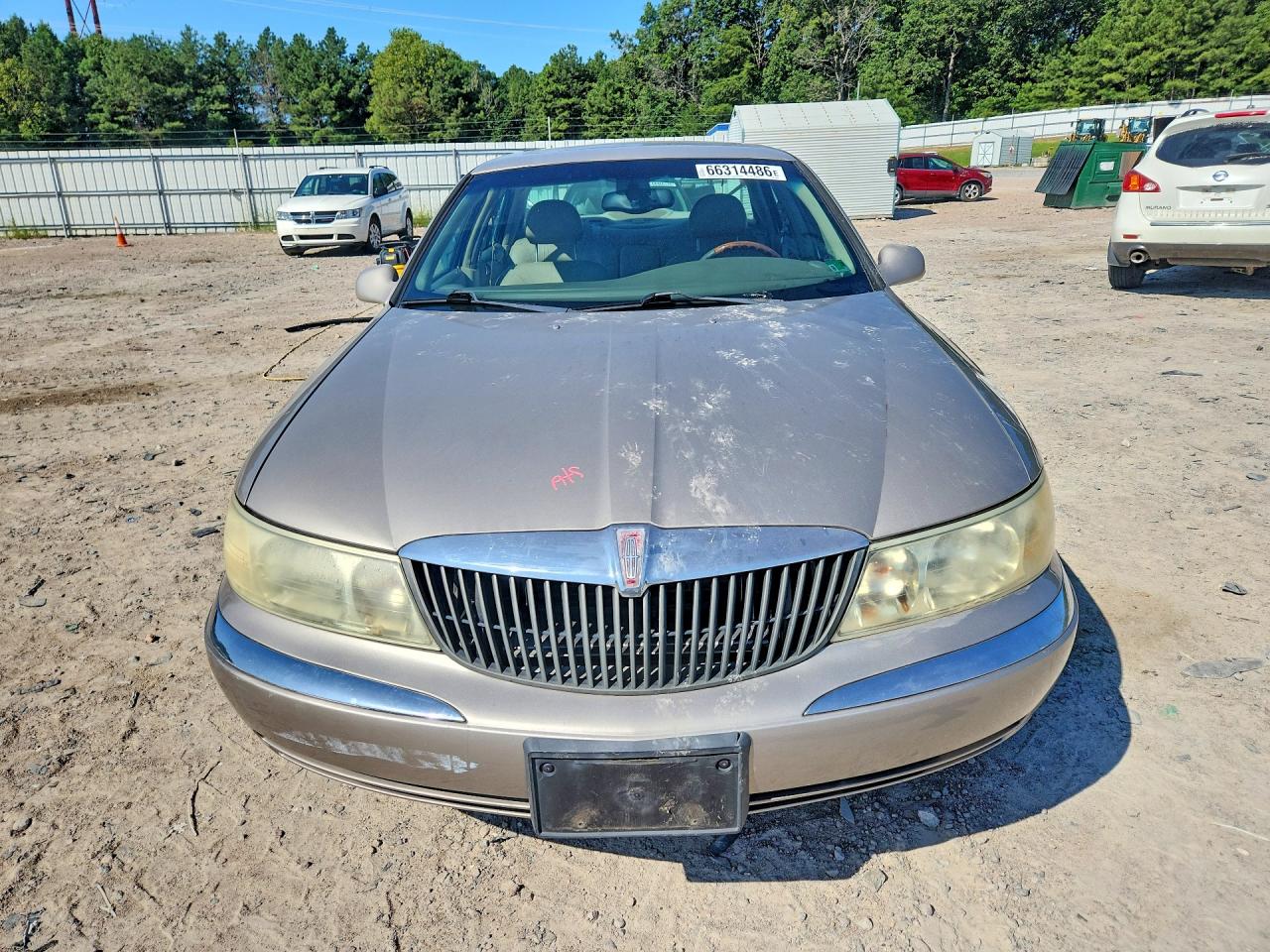 2002 Lincoln Continental Tan vin: 1LNHM97V52Y700089