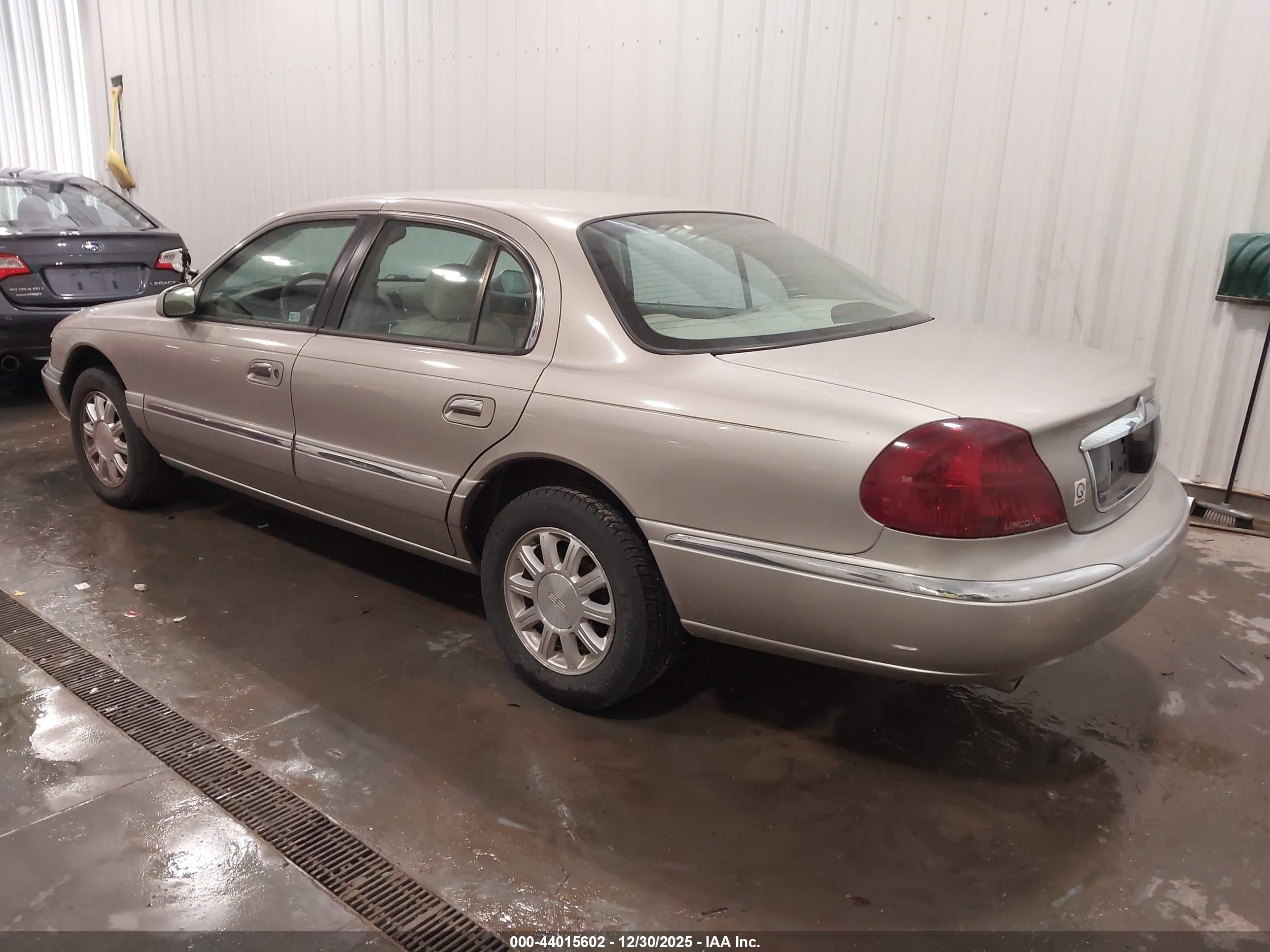 1999 Lincoln Continental   Gold vin: 1LNHM97V5XY640516