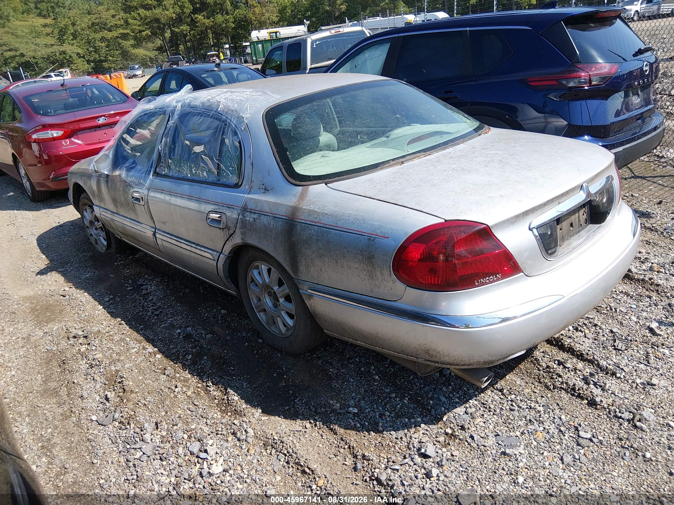 2001 Lincoln Continental   Silver vin: 1LNHM97V61Y670602