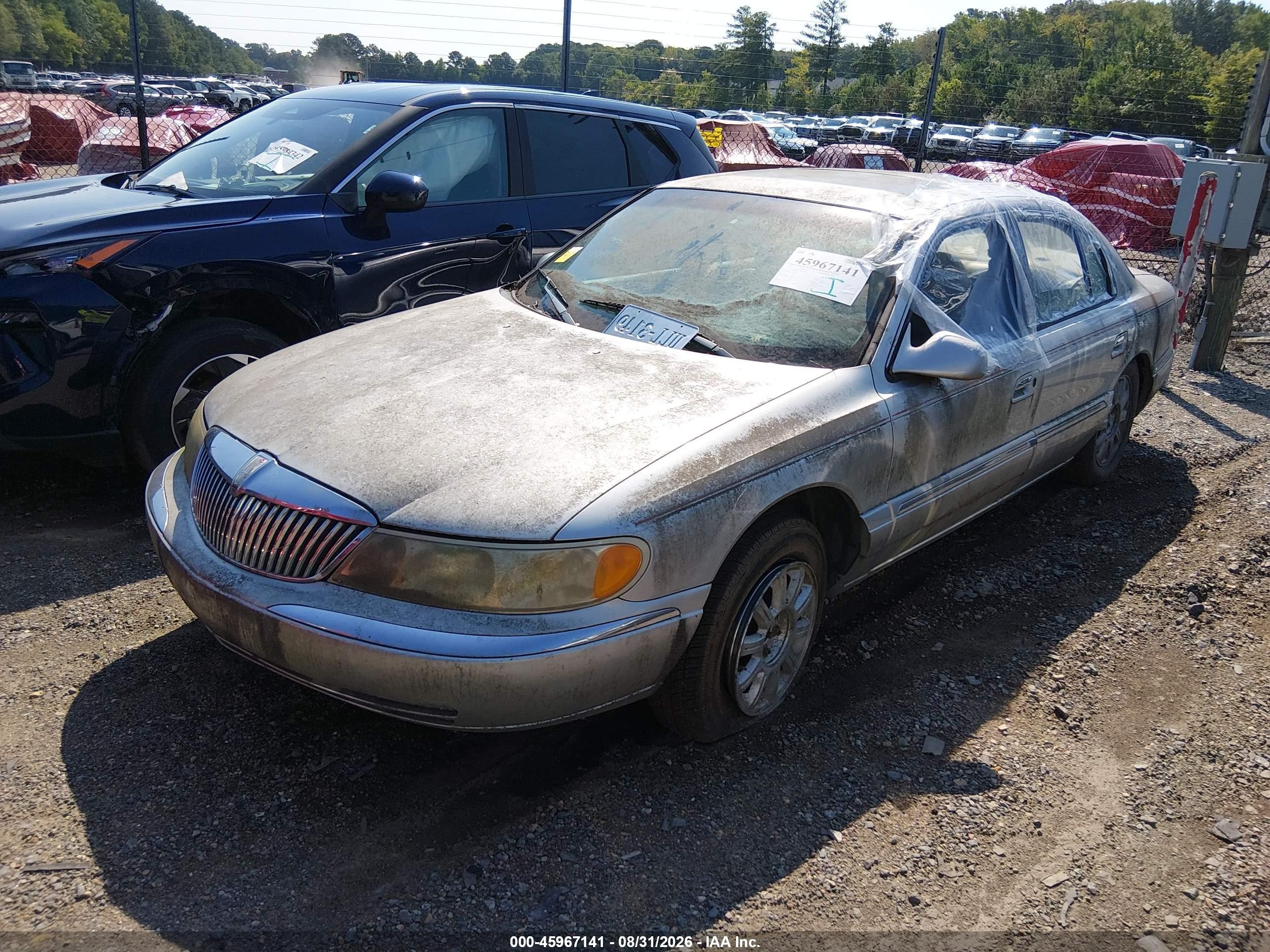 2001 Lincoln Continental   Silver vin: 1LNHM97V61Y670602