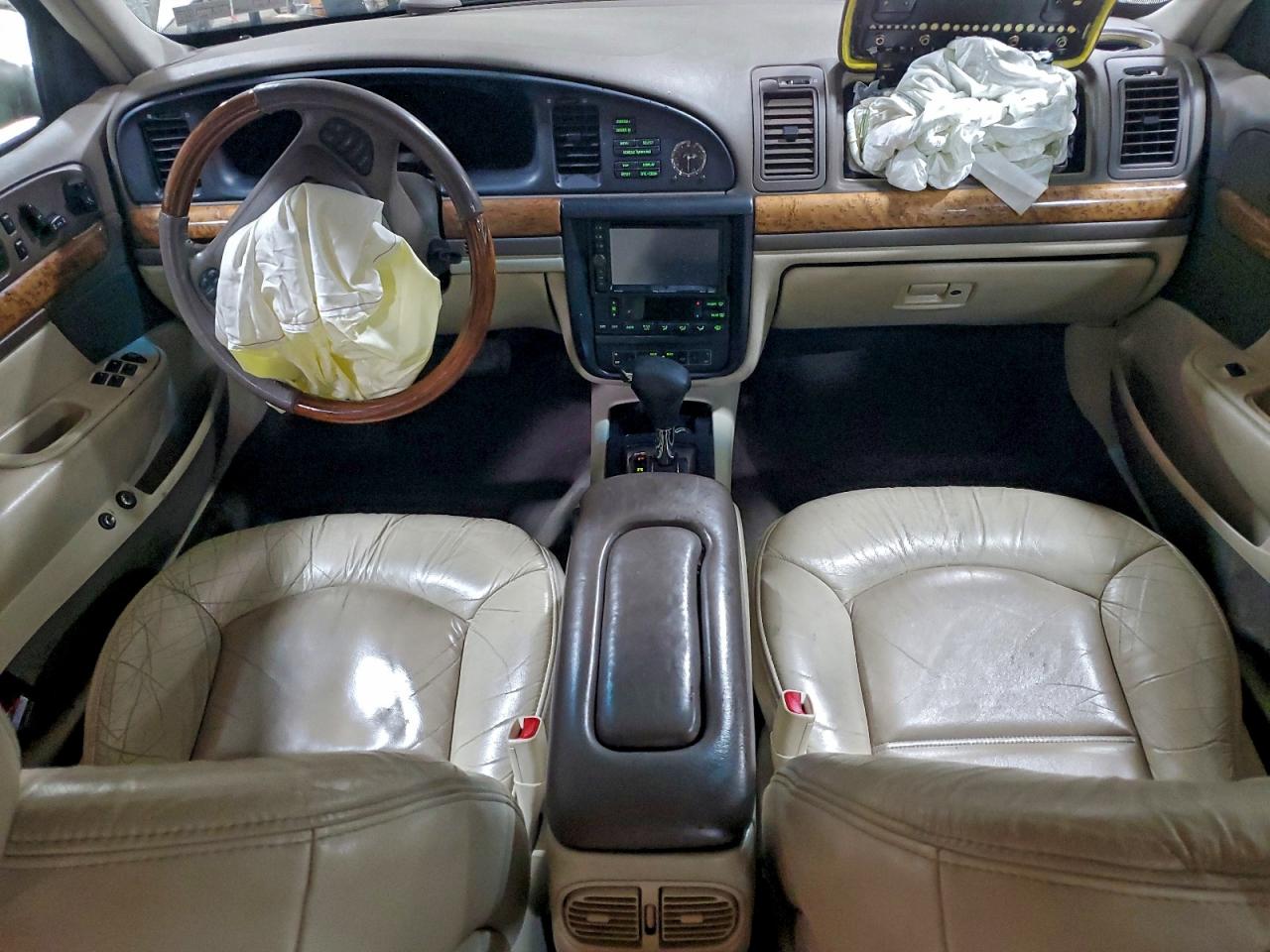 1999 Lincoln Continental Tan vin: 1LNHM97V8XY715869