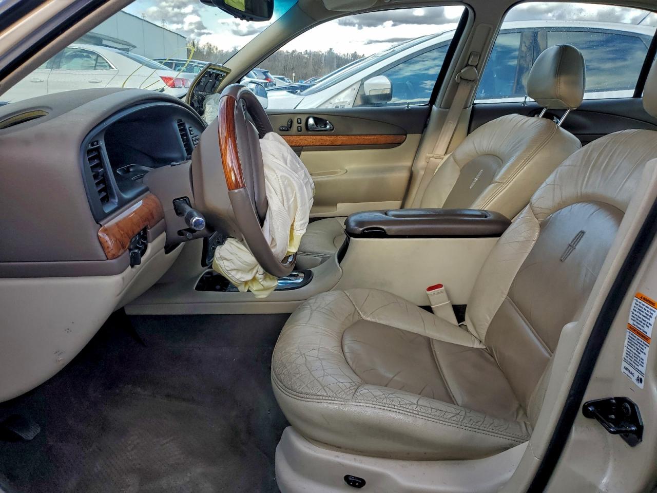 1999 Lincoln Continental Tan vin: 1LNHM97V8XY715869