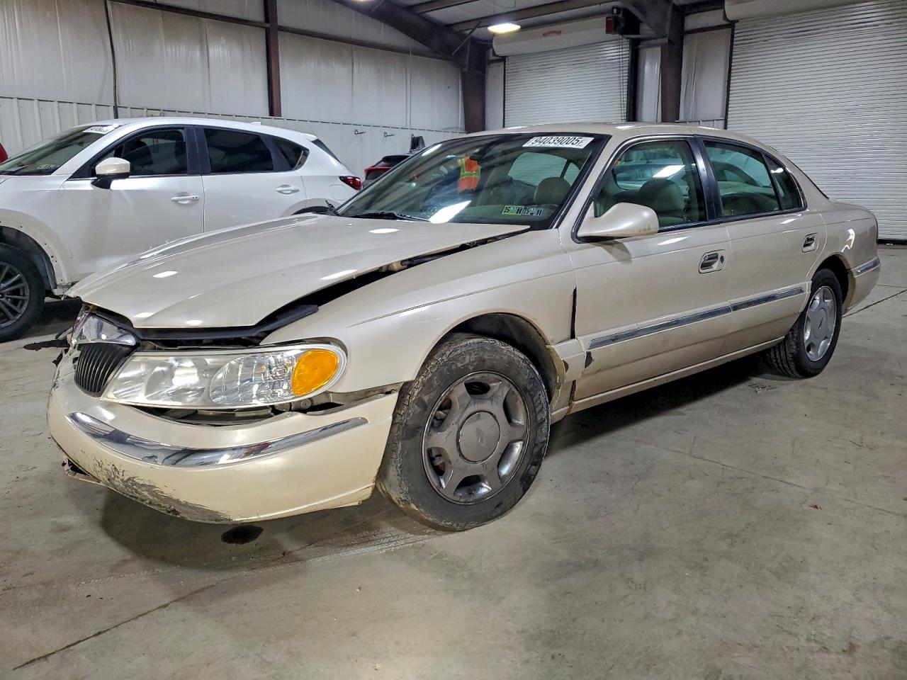 1999 Lincoln Continental Tan vin: 1LNHM97V8XY715869