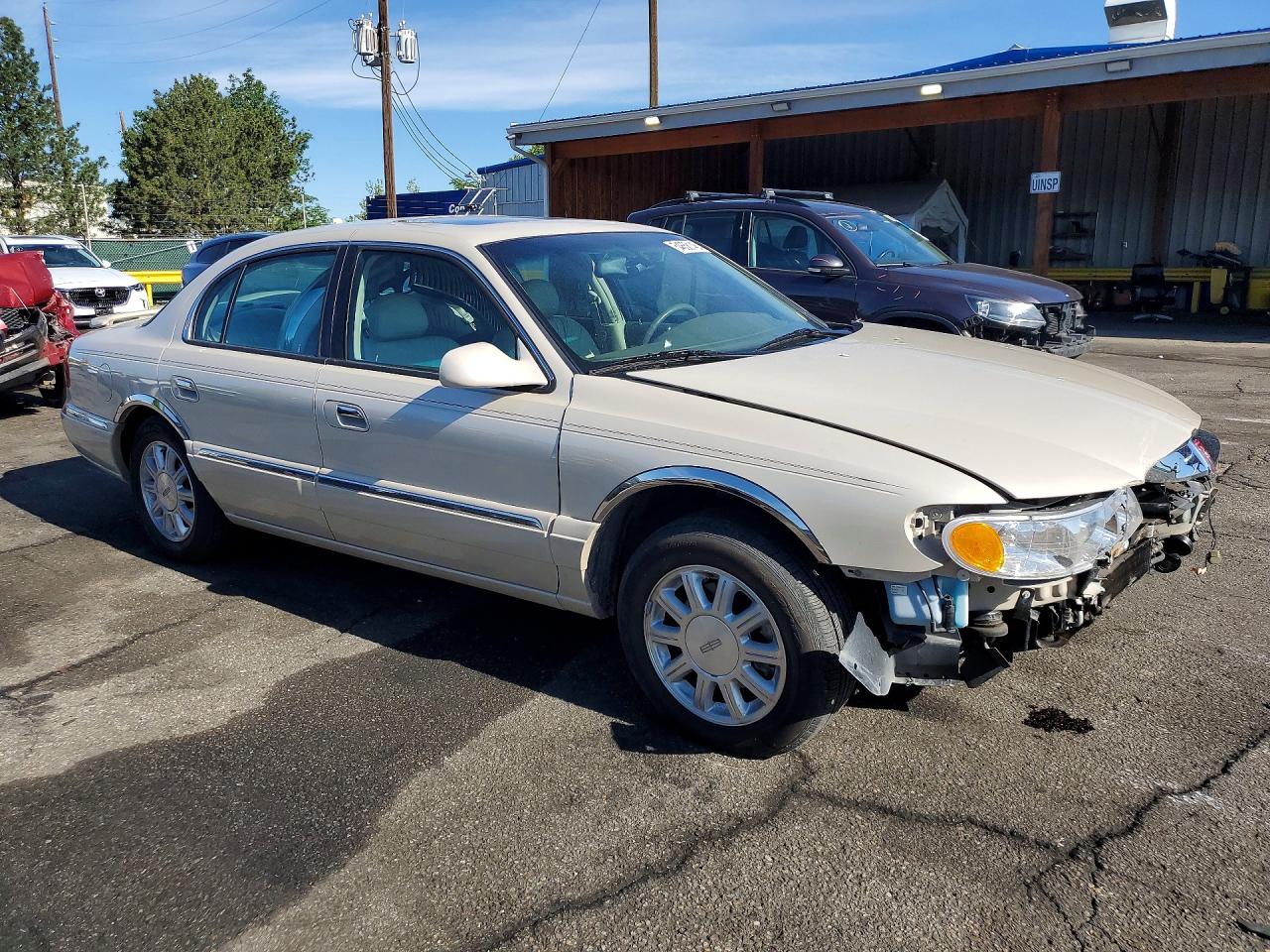 2002 Lincoln Continental Cream vin: 1LNHM97V92Y600531