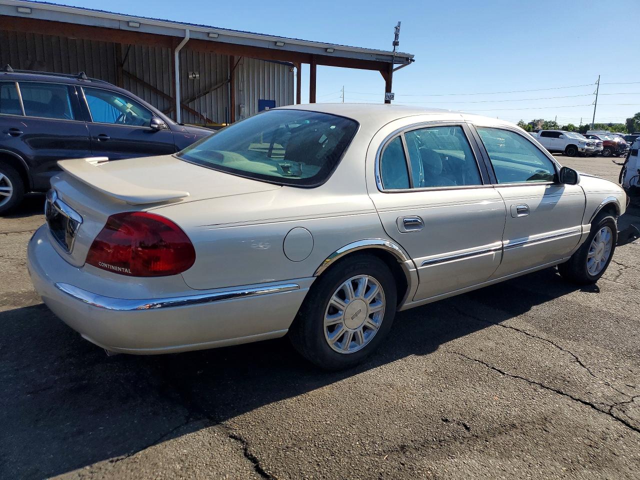 2002 Lincoln Continental Cream vin: 1LNHM97V92Y600531