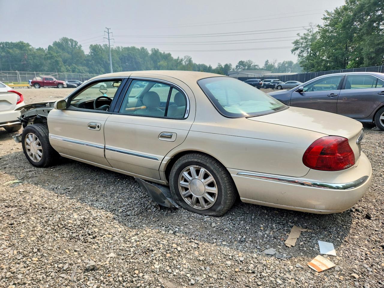 2002 Lincoln Continental Beige vin: 1LNHM97V92Y691963