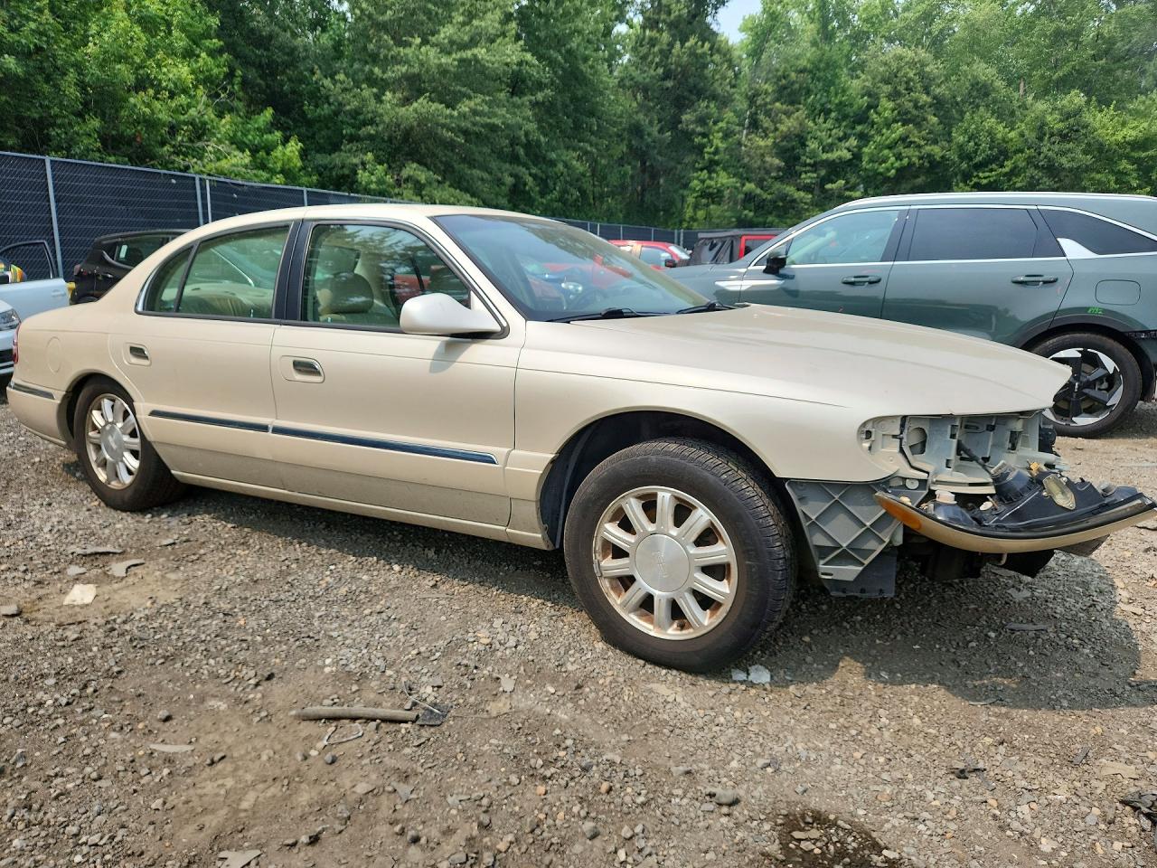 2002 Lincoln Continental Beige vin: 1LNHM97V92Y691963