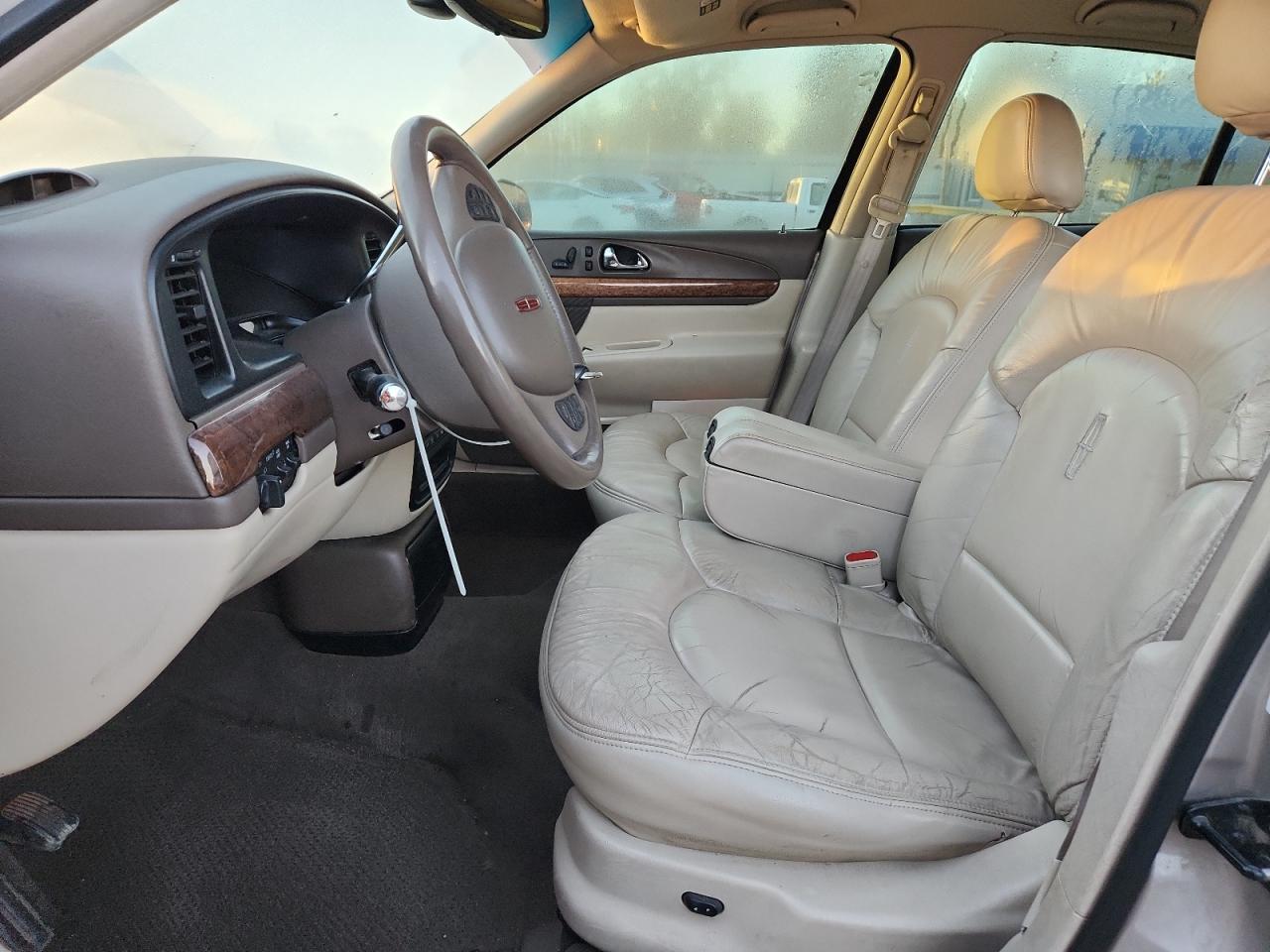 1999 Lincoln Continental Silver vin: 1LNHM97V9XY626635