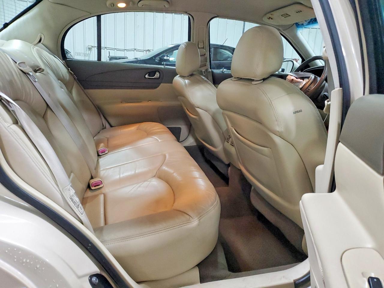 1999 Lincoln Continental Cream vin: 1LNHM97V9XY667458