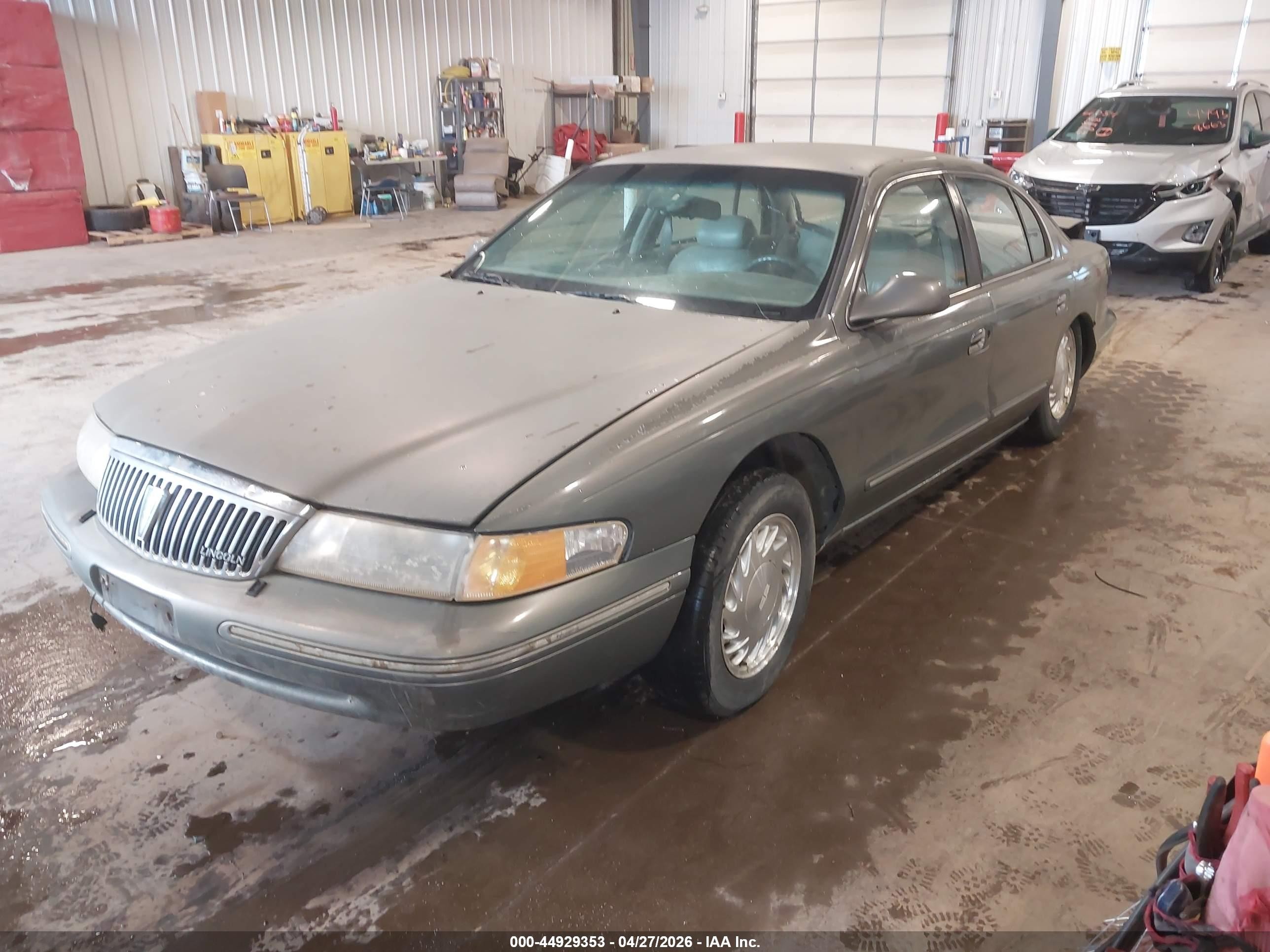1997 Lincoln Continental Tan vin: 1LNLM97V3VY621809