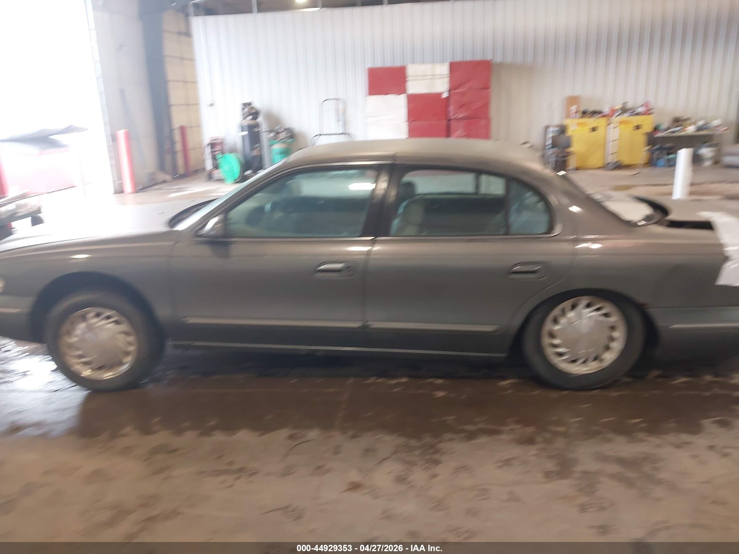 1997 Lincoln Continental Tan vin: 1LNLM97V3VY621809