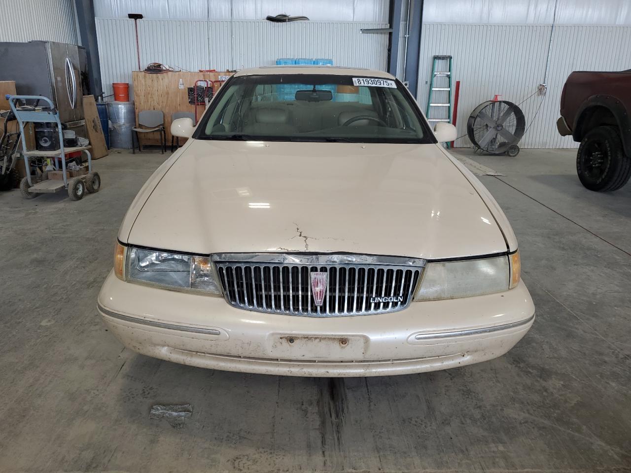 1997 Lincoln Continental Tan vin: 1LNLM97V7VY663898