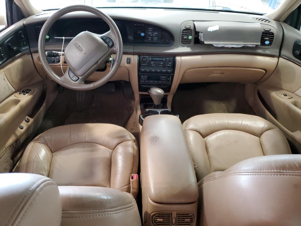 1997 Lincoln Continental Tan vin: 1LNLM97V7VY663898