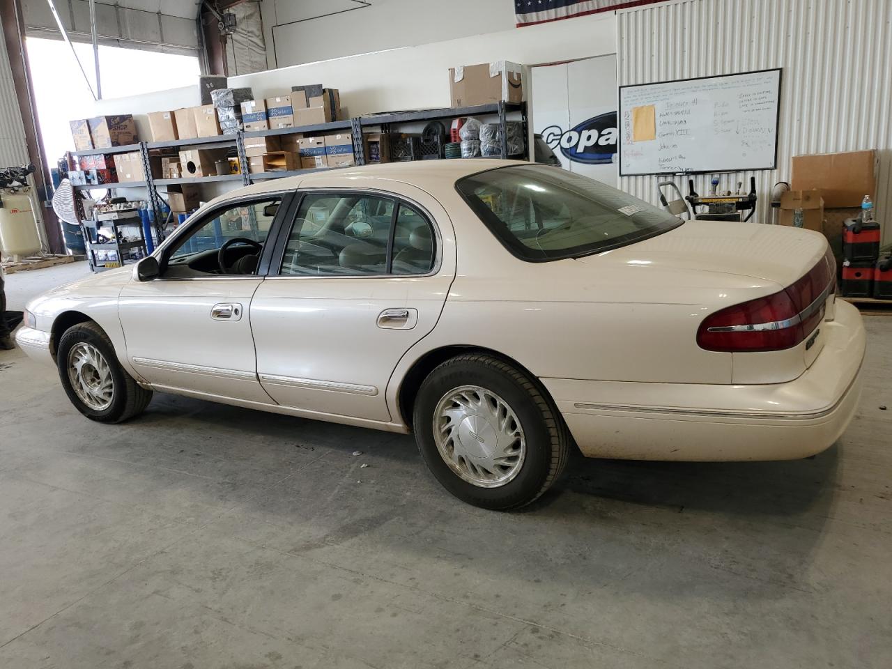 1997 Lincoln Continental Tan vin: 1LNLM97V7VY663898