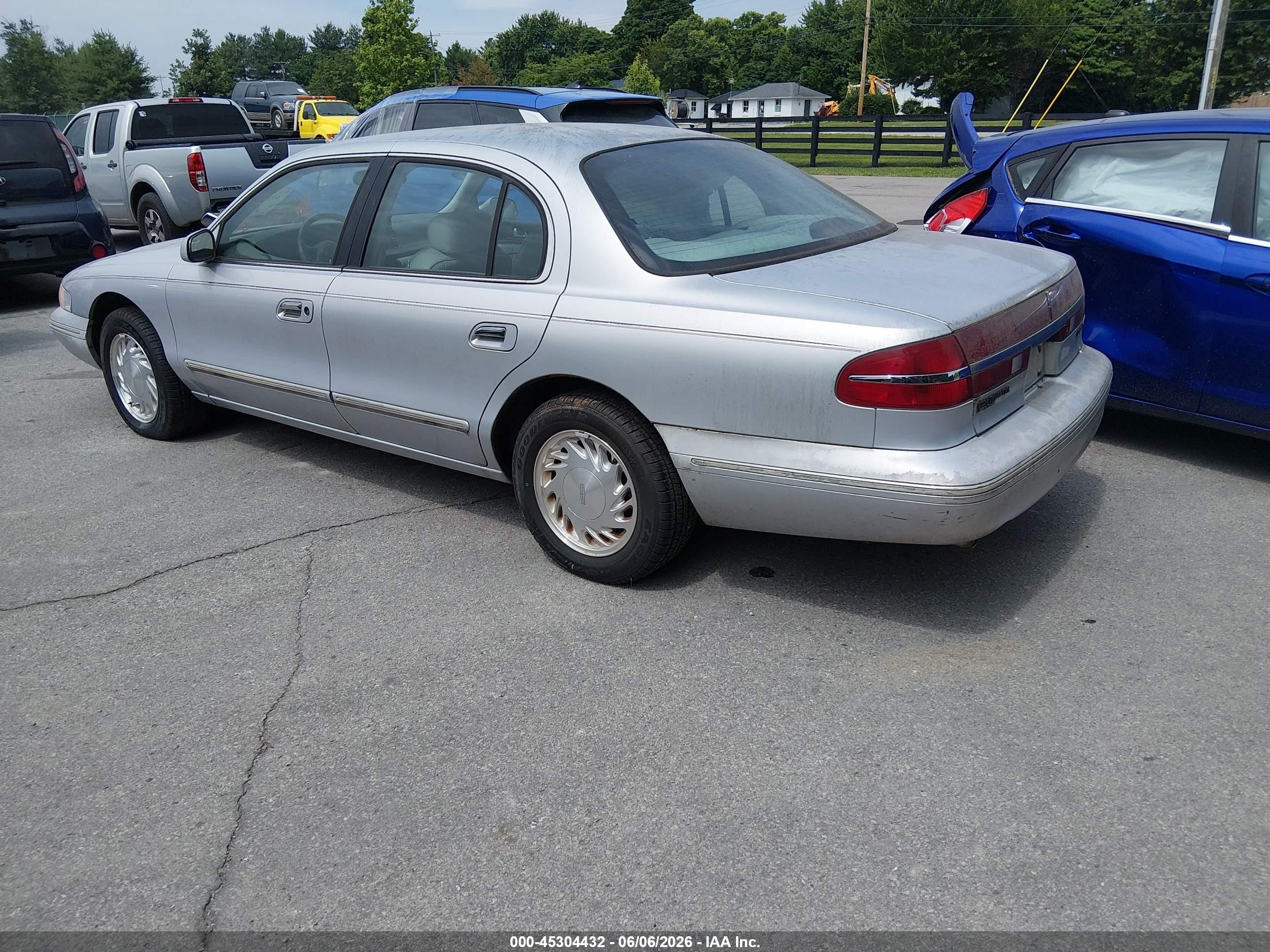 1997 Lincoln Continental   Серебряный vin: 1LNLM97V9VY619997