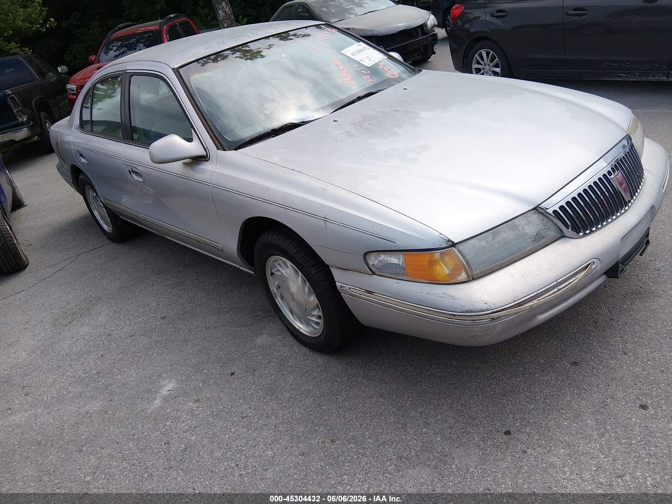 1997 Lincoln Continental   Silver vin: 1LNLM97V9VY619997