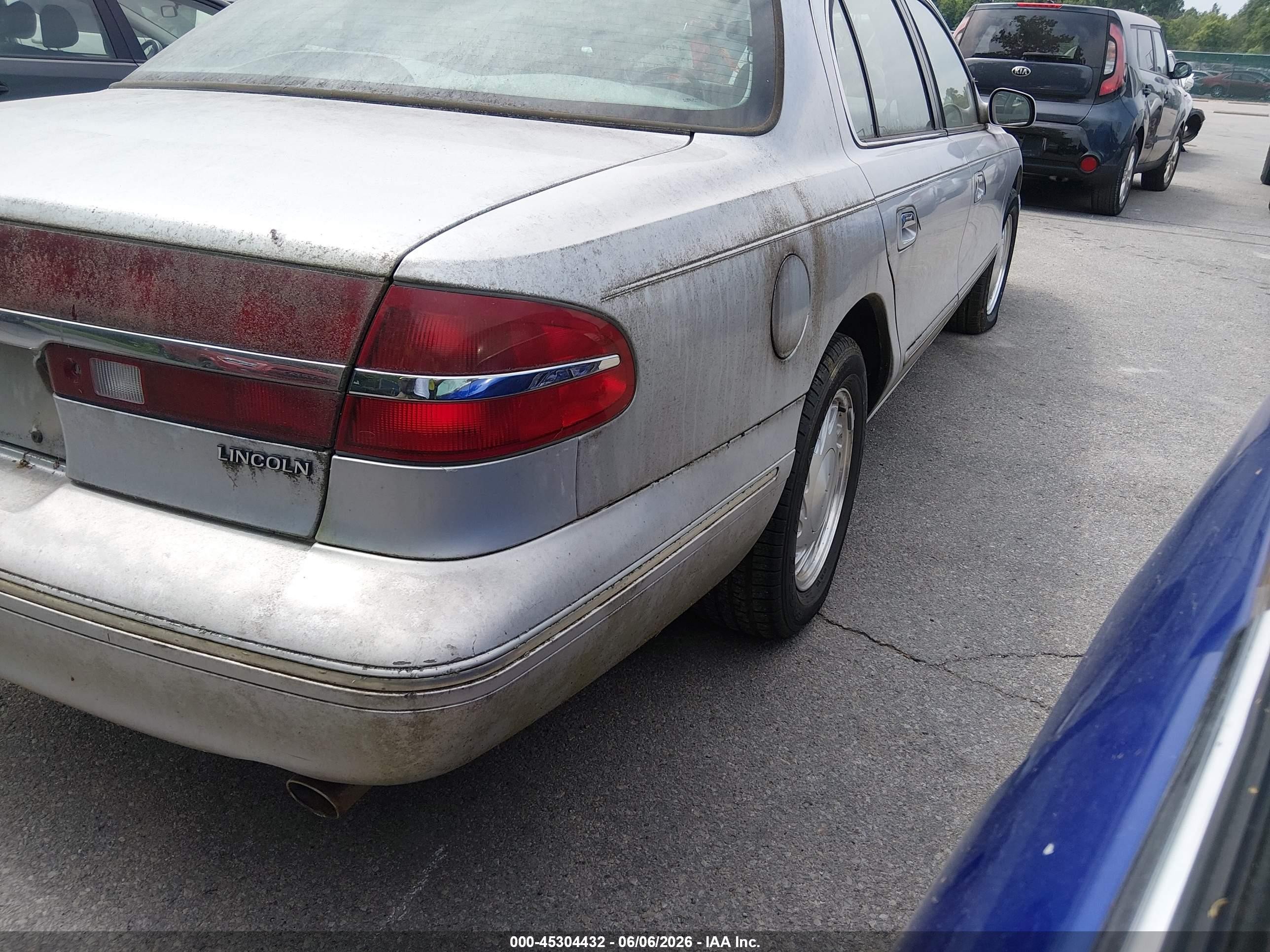1997 Lincoln Continental   Серебряный vin: 1LNLM97V9VY619997