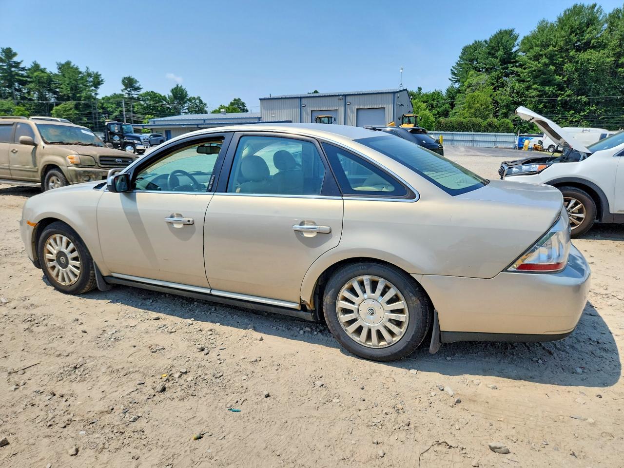 2009 Mercury Sable Cream vin: 1MEHM40W29G610102