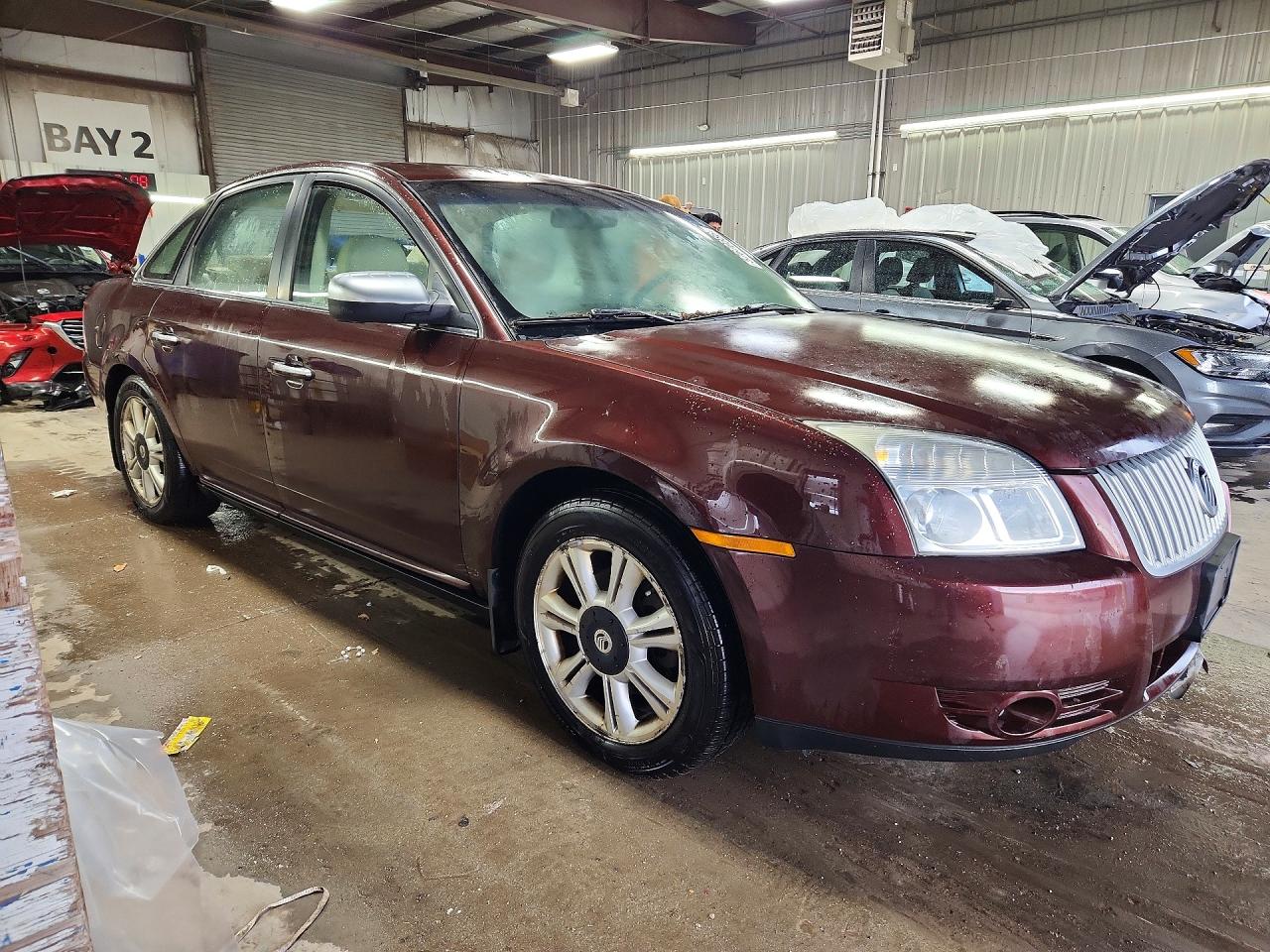 2009 Mercury Sable Premier Maroon vin: 1MEHM42W89G626706