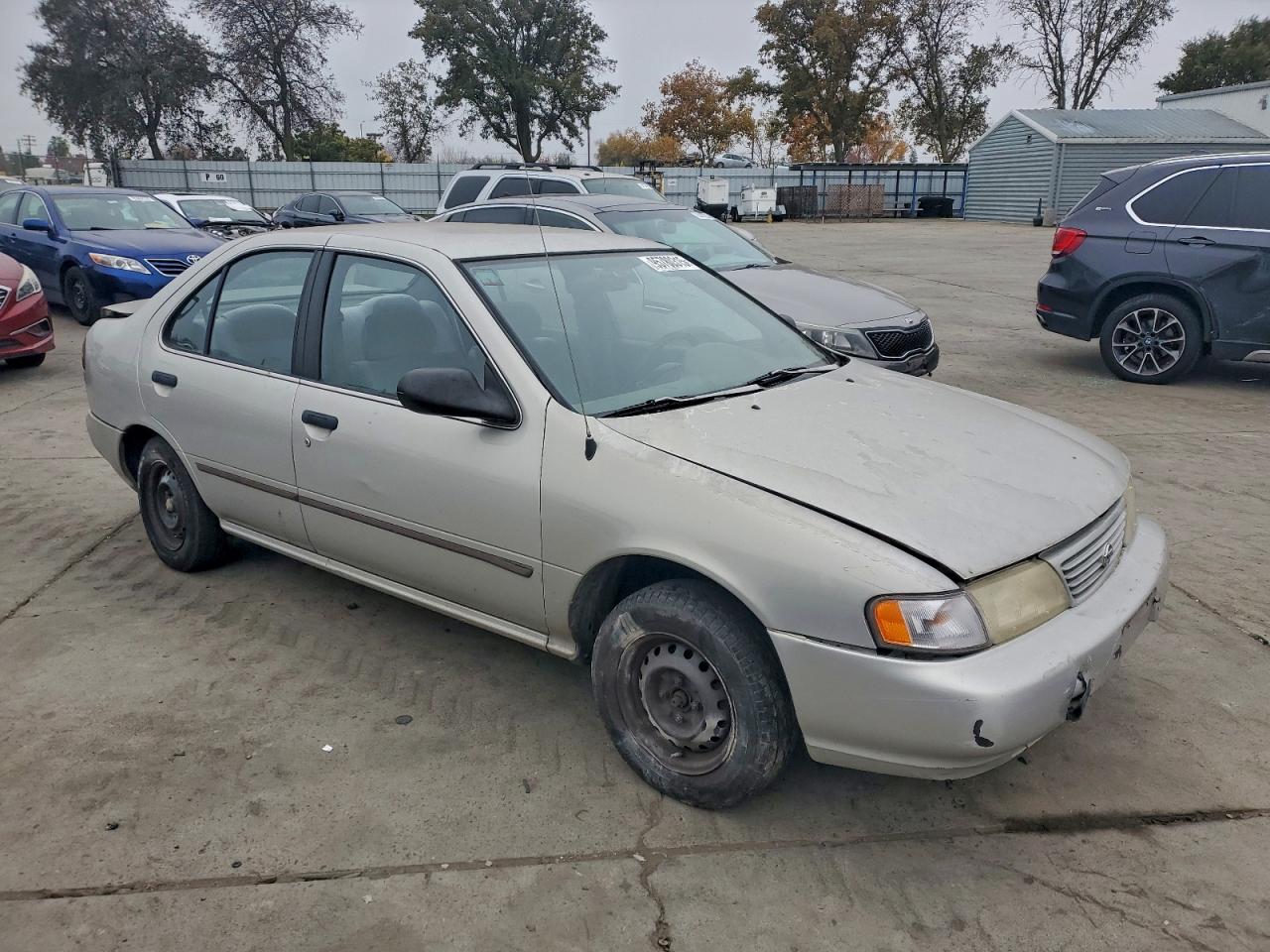 1995 Nissan Sentra Base Tan vin: 1N4AB41D1SC760369