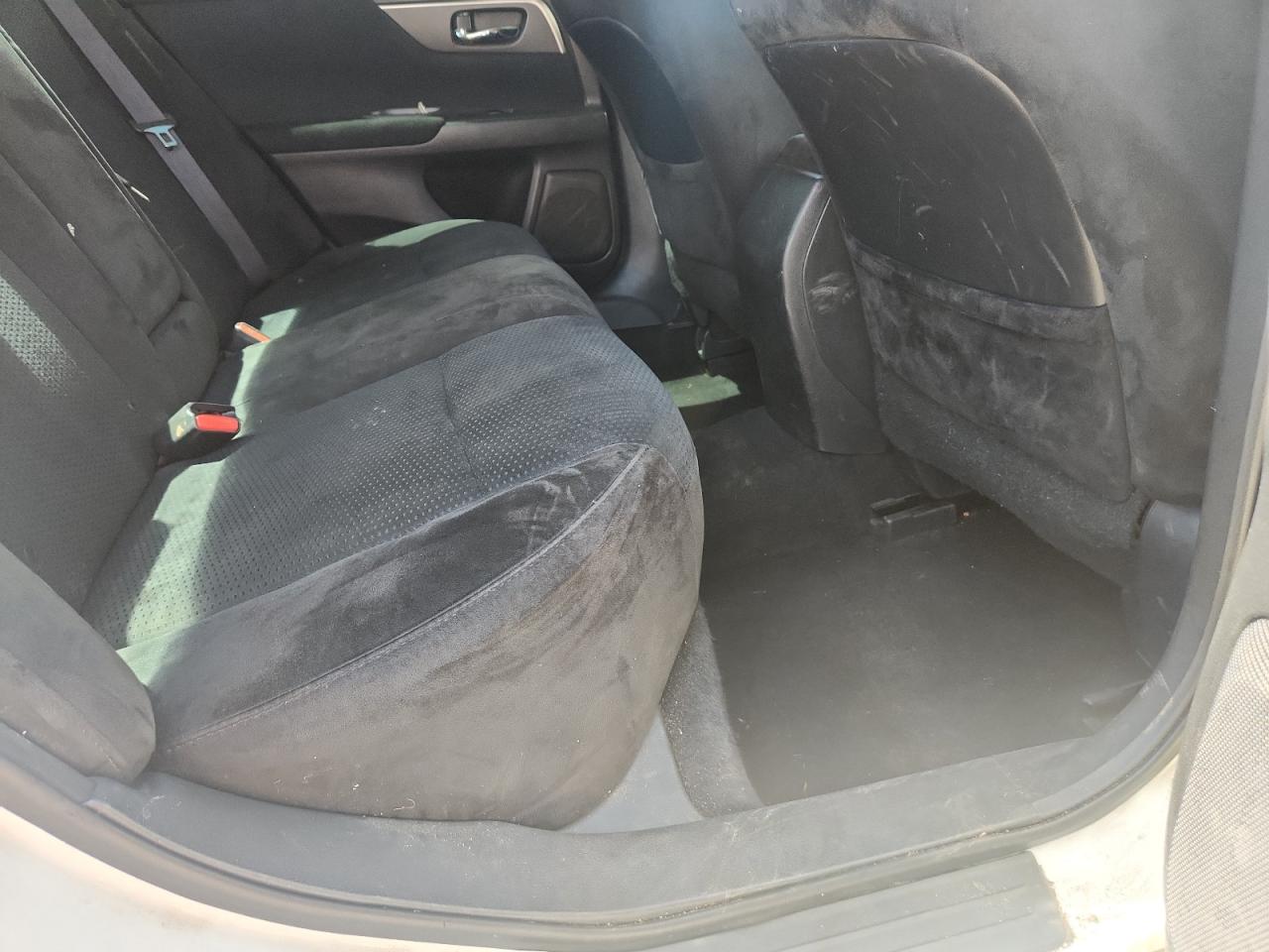2015 Nissan Altima 2.5 S White vin: 1N4AL3AP7FC197464 Damage: Left Rear Seat, Stained, Permanent