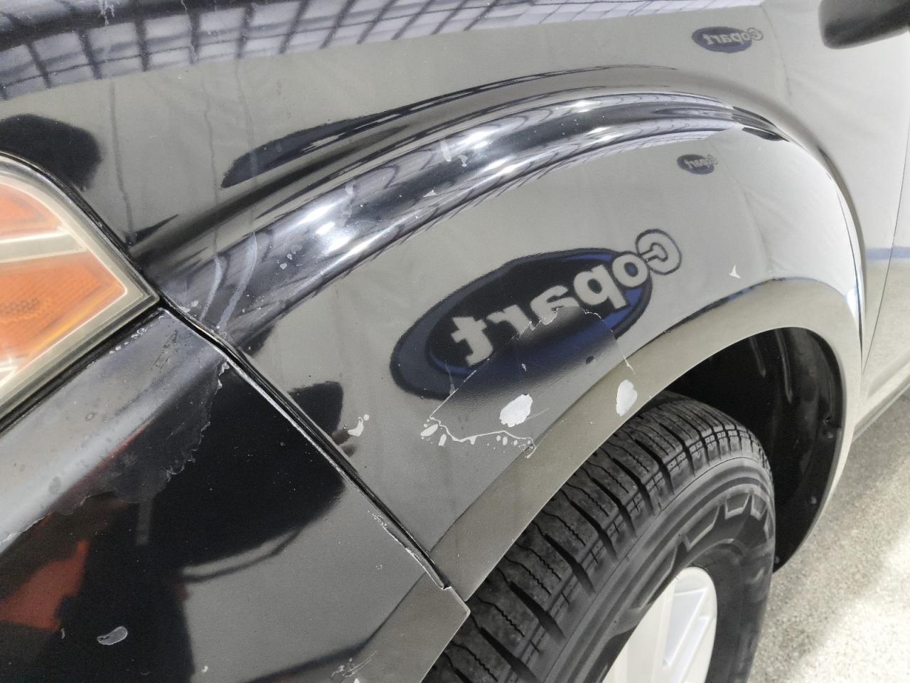 2014 Nissan Frontier S Black vin: 1N6AD0ER0EN723368 Damage: Left Front Fender, Peeling, > 12 Inches