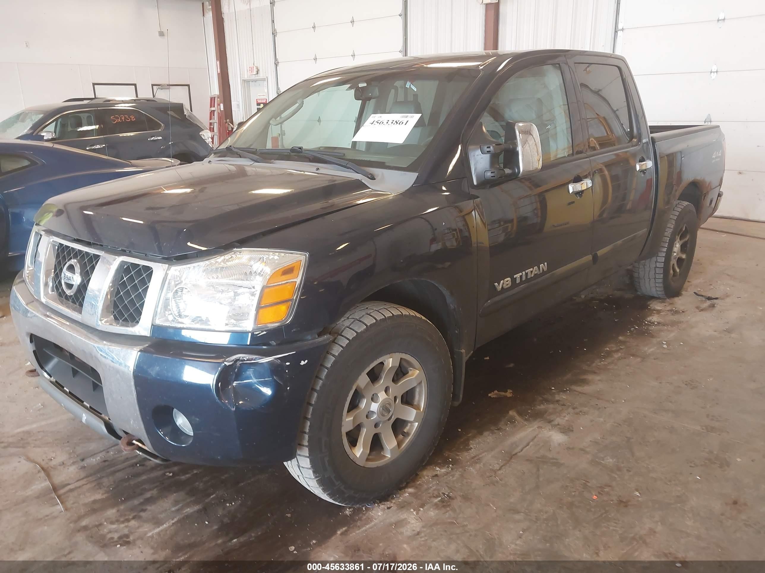 2006 Nissan Titan Le Blue vin: 1N6BA07B96N522017