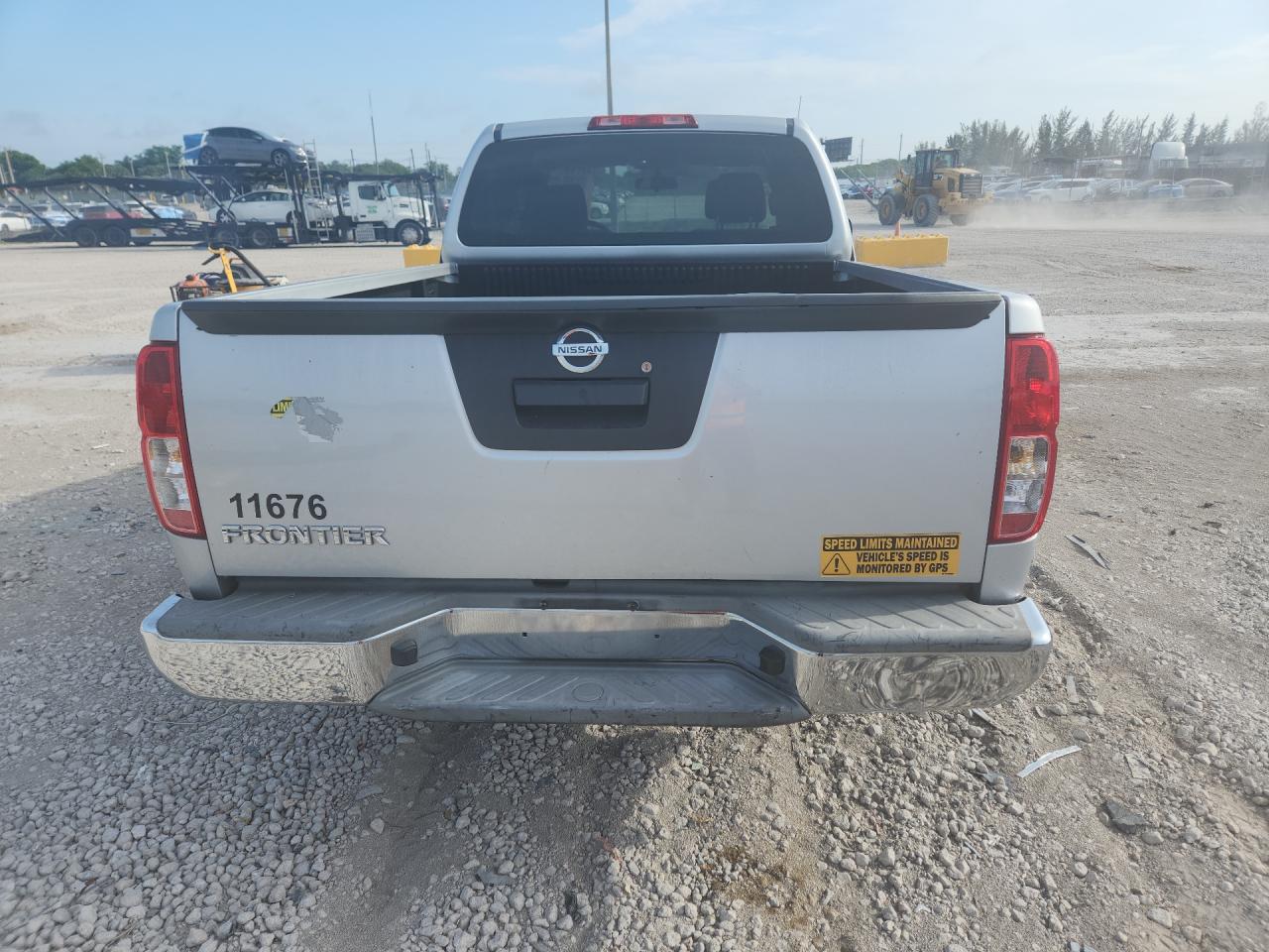 2015 Nissan Frontier S Silver vin: 1N6BD0CTXFN760397 Damage: Rear Metal Bumper Chrome, Broken, Replacement Required