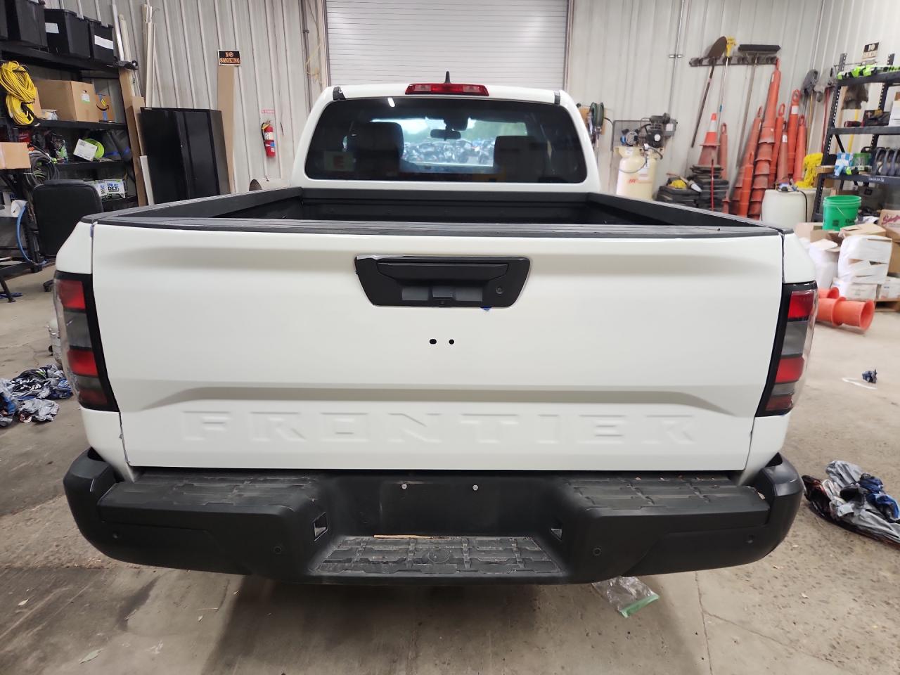 2024 Nissan Frontier S White vin: 1N6ED1CL4RN644975 Damage: Rear Emblem, Missing, Replacement Required