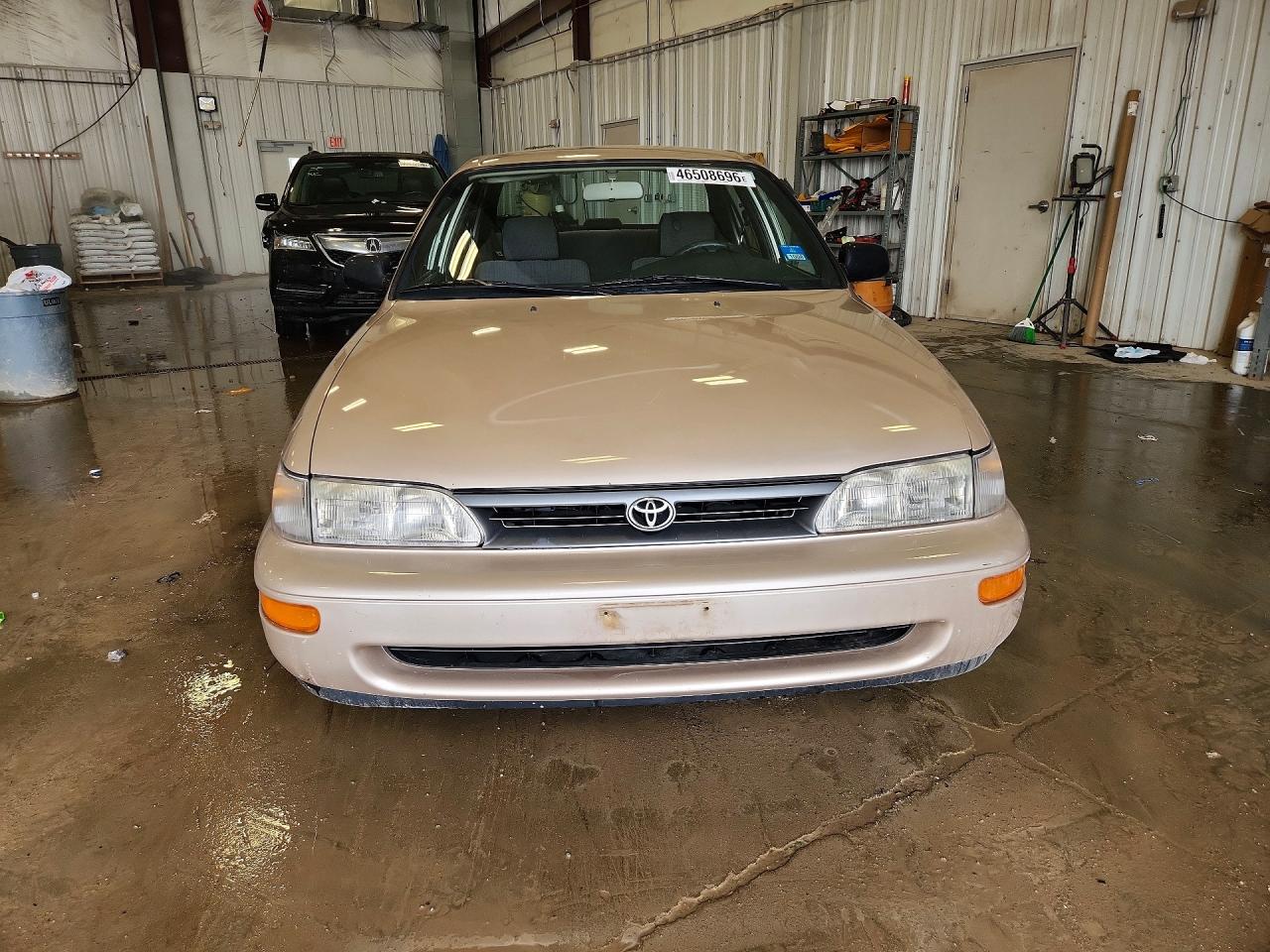 1995 Toyota Corolla Base Желто-коричневый vin: 1NXAE04B3SZ324374