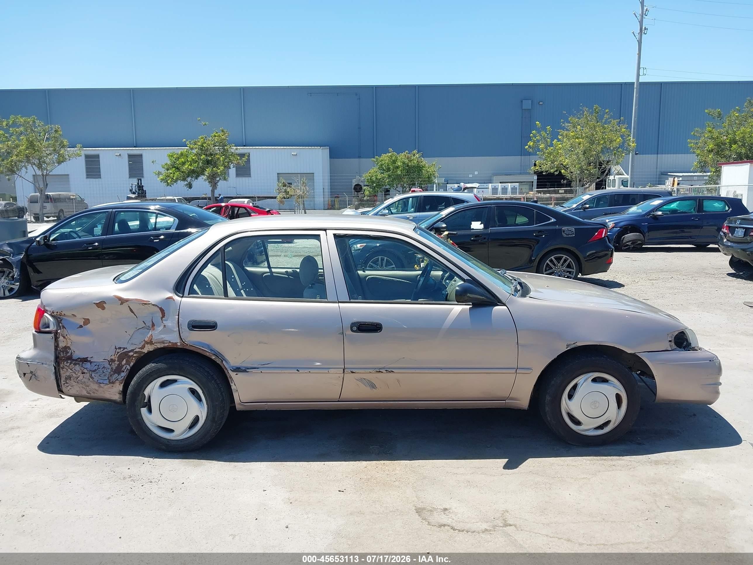 1999 Toyota Corolla Ce Gold vin: 1NXBR12E1XZ159282