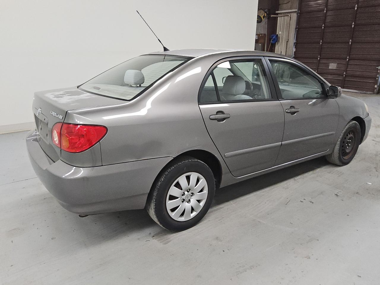 2004 Toyota Corolla Le Gray vin: 1NXBR32EX4Z336600 Damage: Right Front Wheel Cover, Broken, Replacement Required