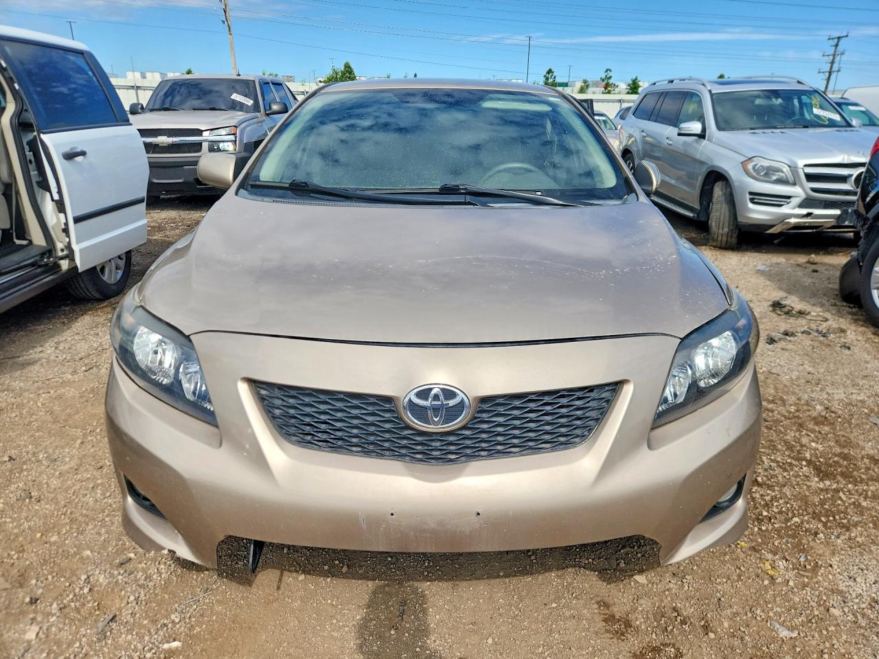 2009 Toyota Corolla Le Tan vin: 1NXBU40E19Z089529