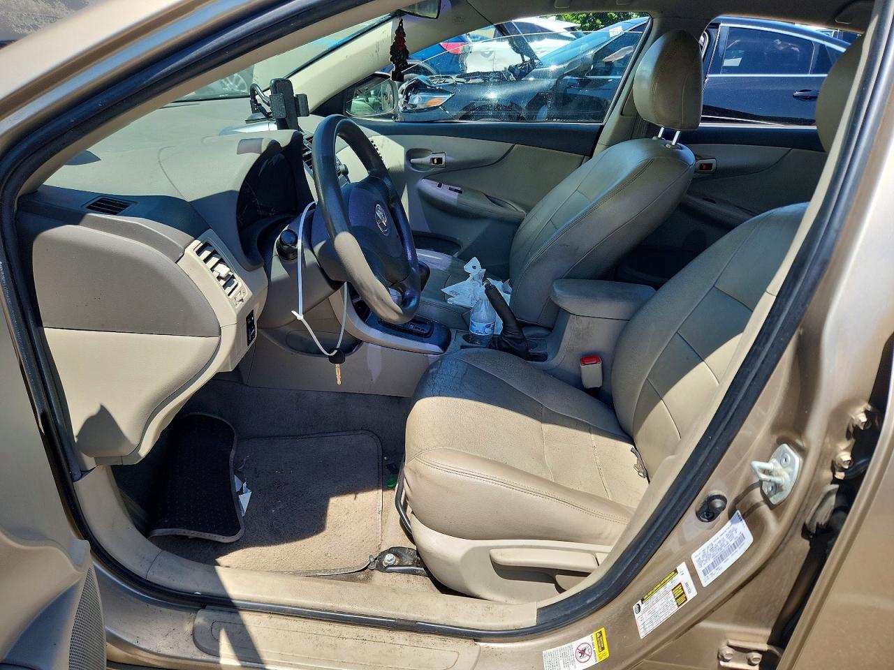 2009 Toyota Corolla Le Tan vin: 1NXBU40E59Z073365