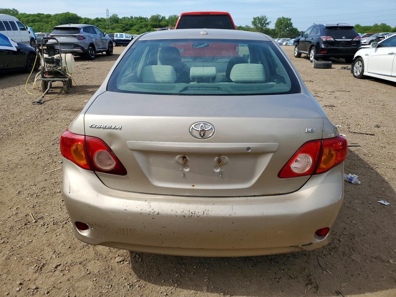 2009 Toyota Corolla Le Gold vin: 1NXBU40E59Z132995