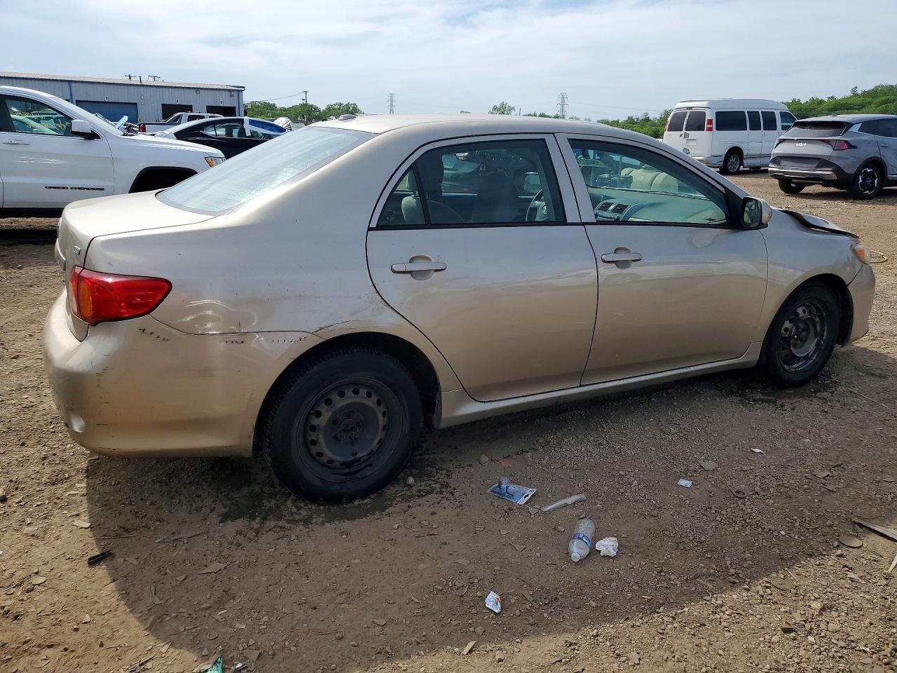 2009 Toyota Corolla Le Gold vin: 1NXBU40E59Z132995