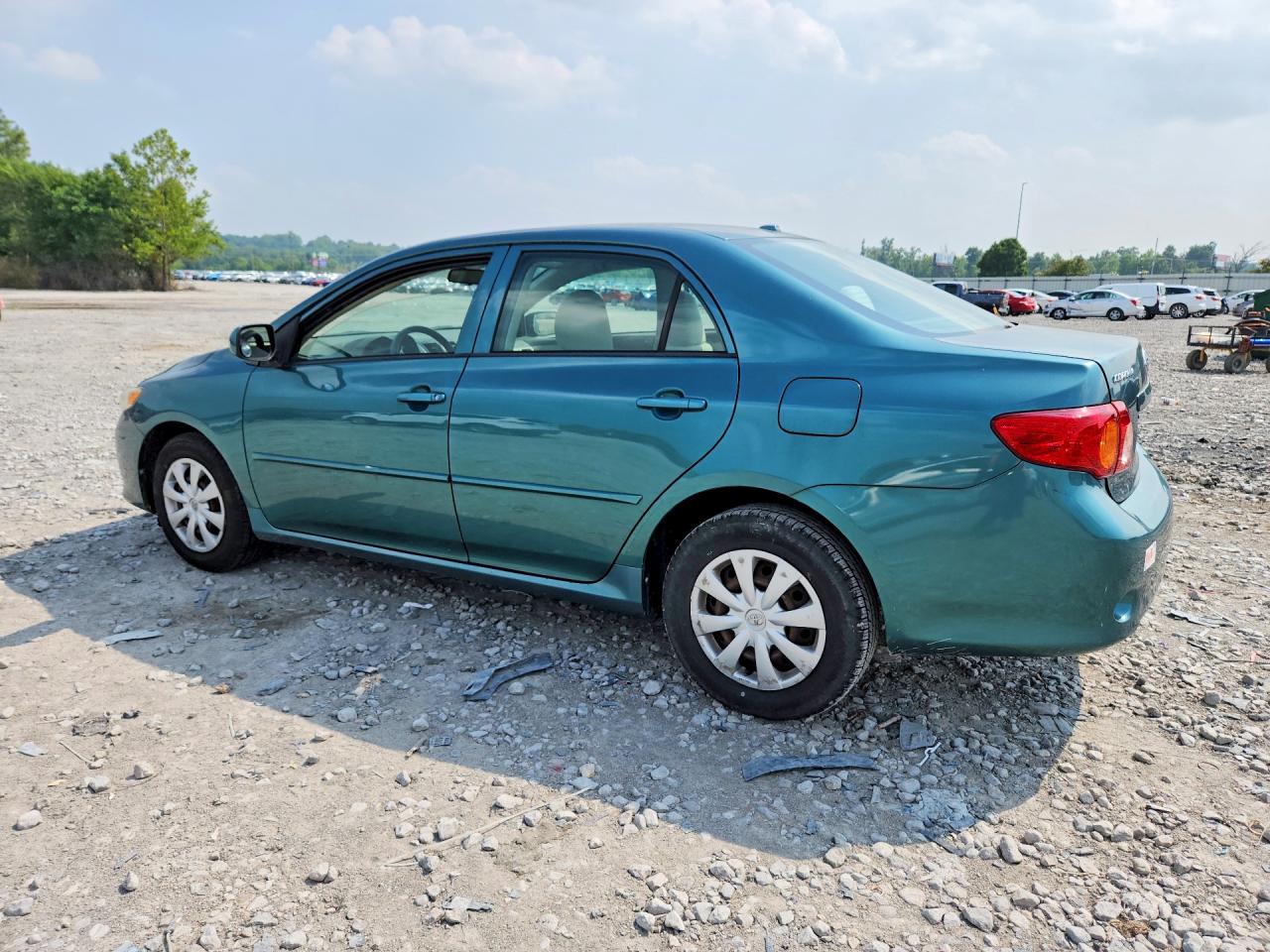 2009 Toyota Corolla Le Teal vin: 1NXBU40E59Z145665