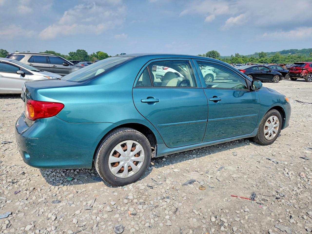 2009 Toyota Corolla Le Teal vin: 1NXBU40E59Z145665