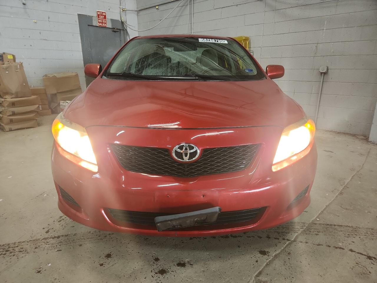 2009 Toyota Corolla Le Red vin: 1NXBU40E69Z151796 Damage: Left Head Lamp, Faded, Repair Required