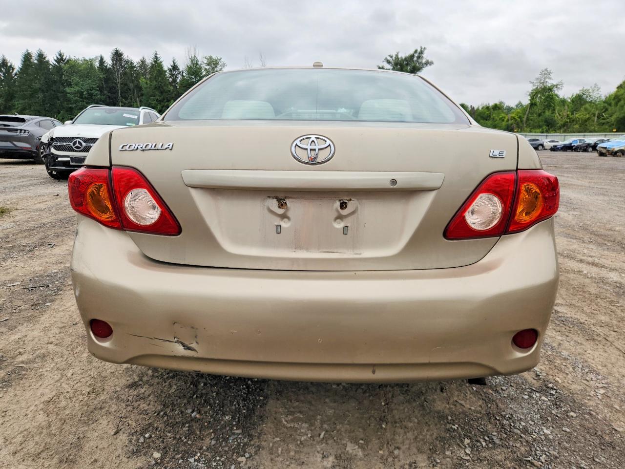 2009 Toyota Corolla Le Gold vin: 1NXBU40E79Z027164